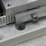 Belt clamp inside machine
